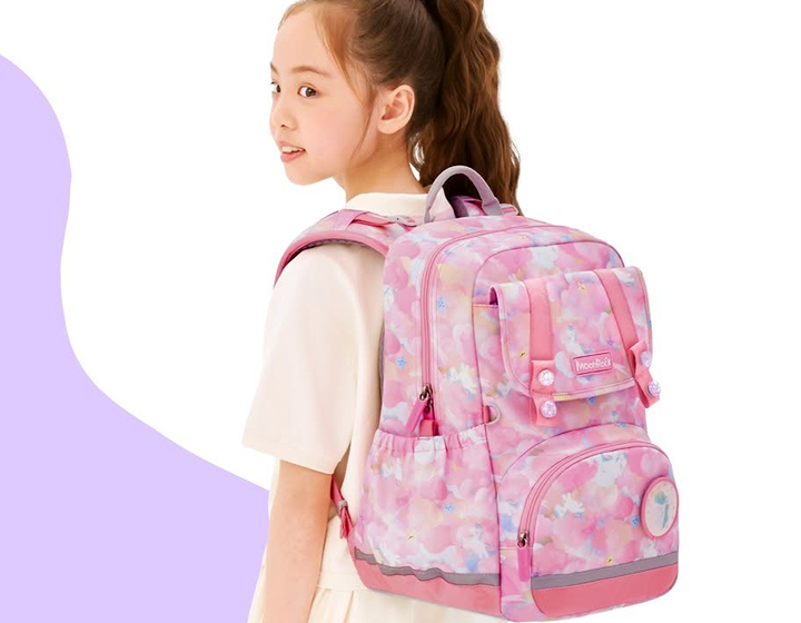 young girl with a pink ergonomic backpack from Moonrock; where to buy school bags and backpacks in hong kong for children ergonomic brand Moonrock