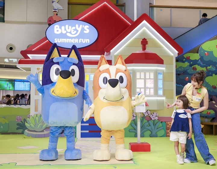 bluey and bingo characters pose with a little girl at The Lohas Hong Kong