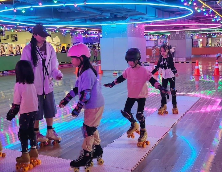 children roller skating indoors at buns in Hong Kong