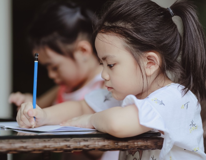 a girl studies at a hk school with a debenture