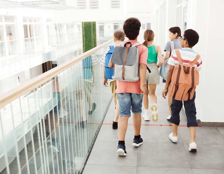school students in corridor at a Hong Kong international school with a debenture