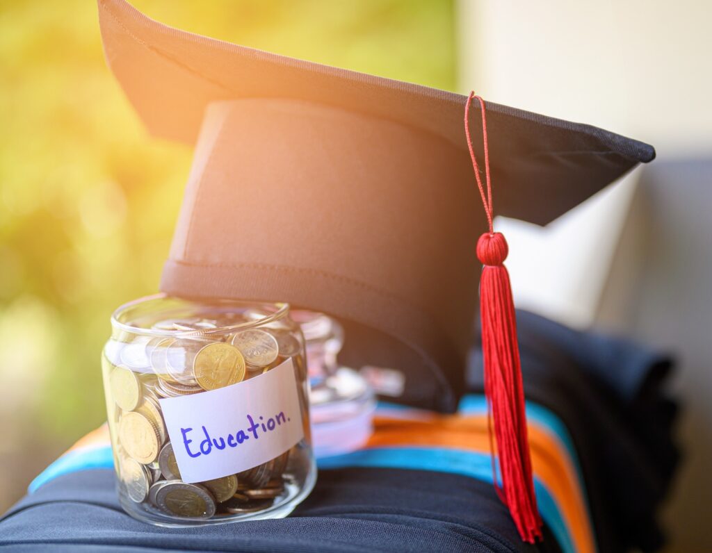 graduation cap and savings to cover Hong Kong international school fees