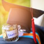 graduation cap and savings to cover Hong Kong international school fees