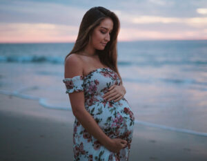 Pregnant woman wearing a maternity dress by the beach in Hong Kong, where to buy the best maternity clothes in HK