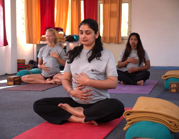 women in a prenatal yoga class