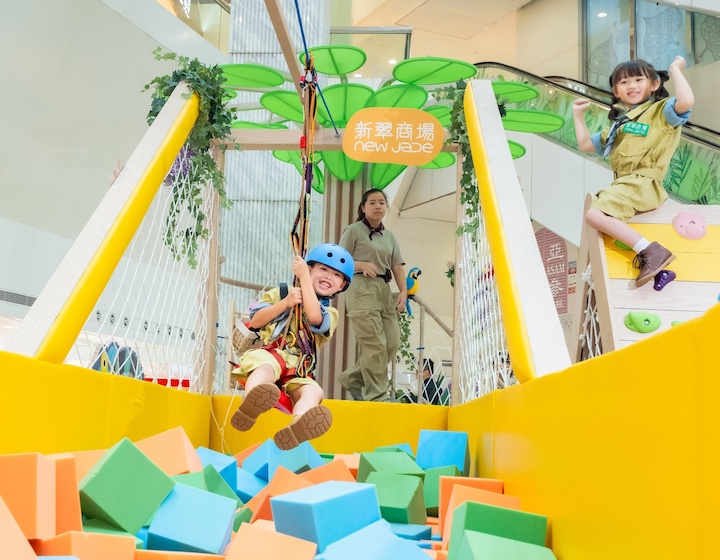 a child zip lines over a foam pit at the new jade shopping arcade kids activity in Hong Kong