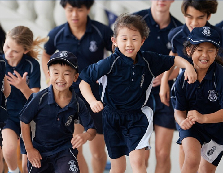 students of Harrow International School Hong Kong running through the campus