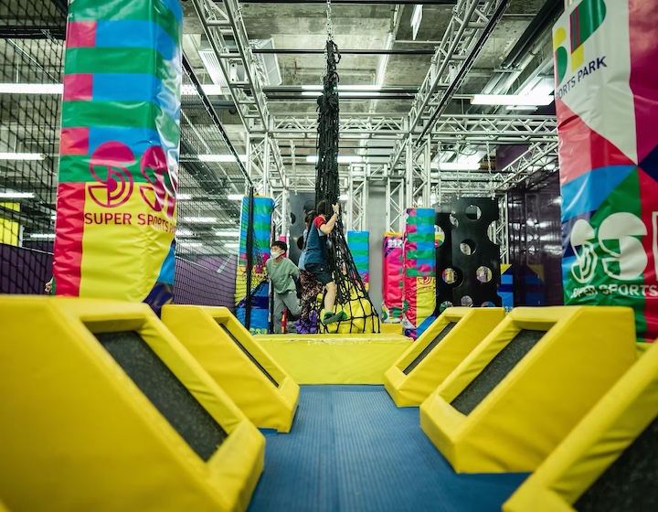 a child tackles the ninja course at super sports park Hong Kong