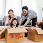 Family packing up their house to move with boxes from Asia United Group relocation company