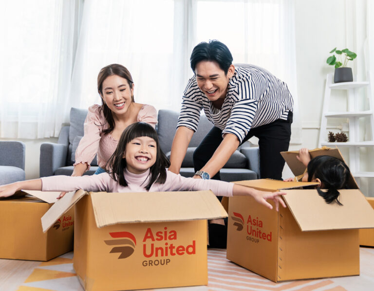 Family packing up their house to move with boxes from Asia United Group relocation company