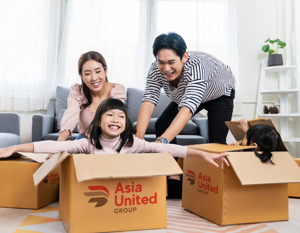 Family packing up their house to move with boxes from Asia United Group relocation company