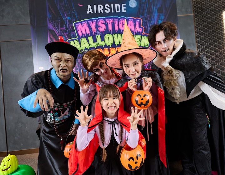 a family in cosplay halloween costumes goes trick or treating at AIRSIDE's mystical halloween celebrations in 2026
