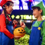 two children dressed in cosplay as Mario brothers for halloween in Hong Kong