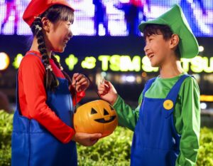 two children dressed in cosplay as Mario brothers for halloween in Hong Kong