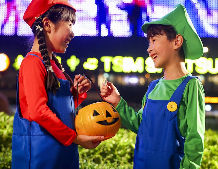 two children dressed in cosplay as Mario brothers for halloween in Hong Kong