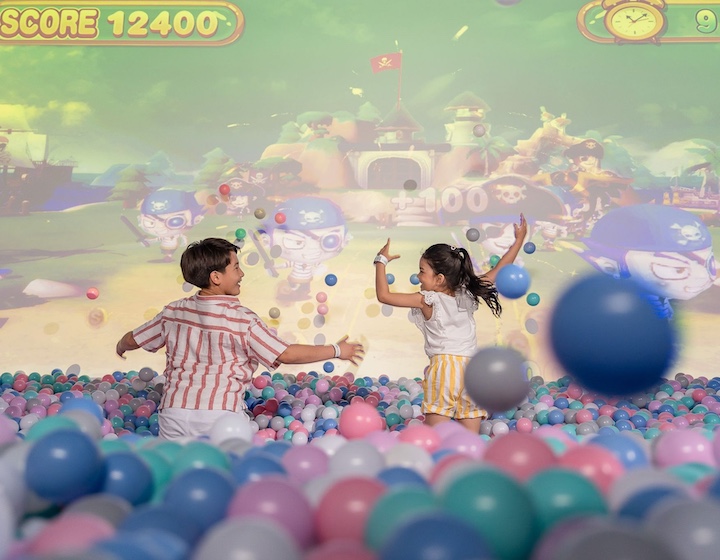 children play in a ball pit at the holiday inn resort phuket