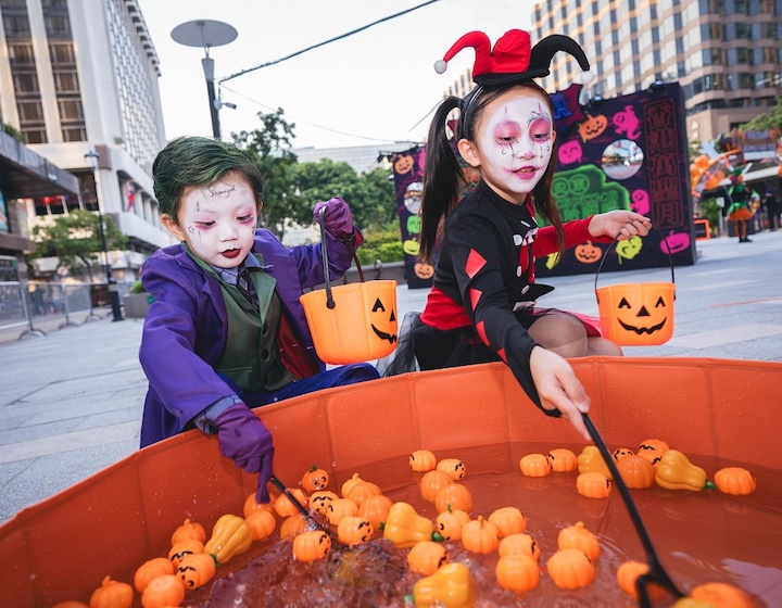 children playing bob for apples at the Hong Kong Halloween 2026 celebrations in tst