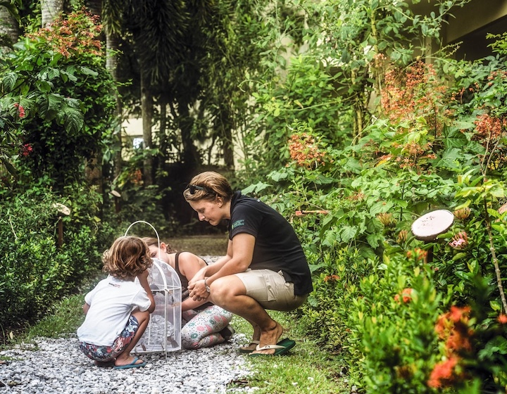 two children explore nature at the kids club at phuket Marriott resort and spa, Thailand