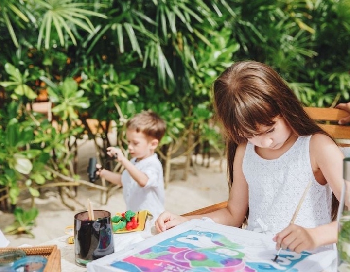 two children do activities outdoors at trisara luxury villa resort in phuket