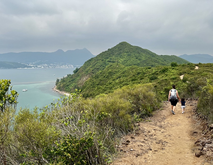 Sassy Mama editor Jessica Mizzi hikes along the mountain top of Sharp Island with her daughter