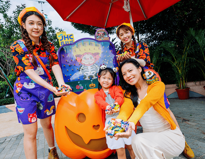 a mother and daughter trick-or-treating with performers at Ocean Park Hong Kong during halloween 2026