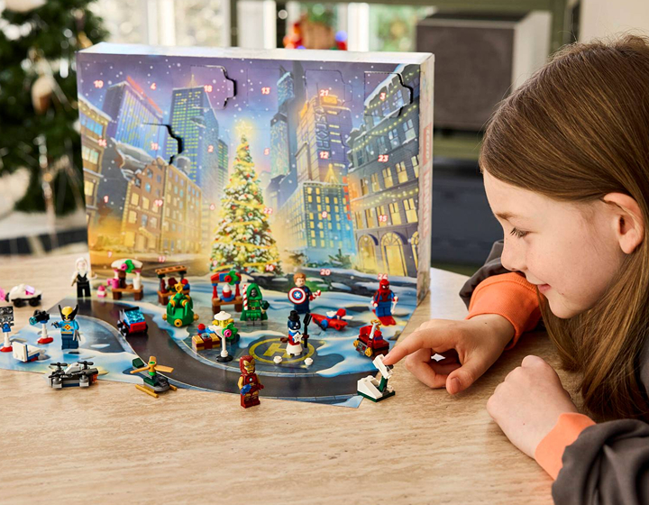 Young girl playing with LEGO Marvel Advent Calendar 2026