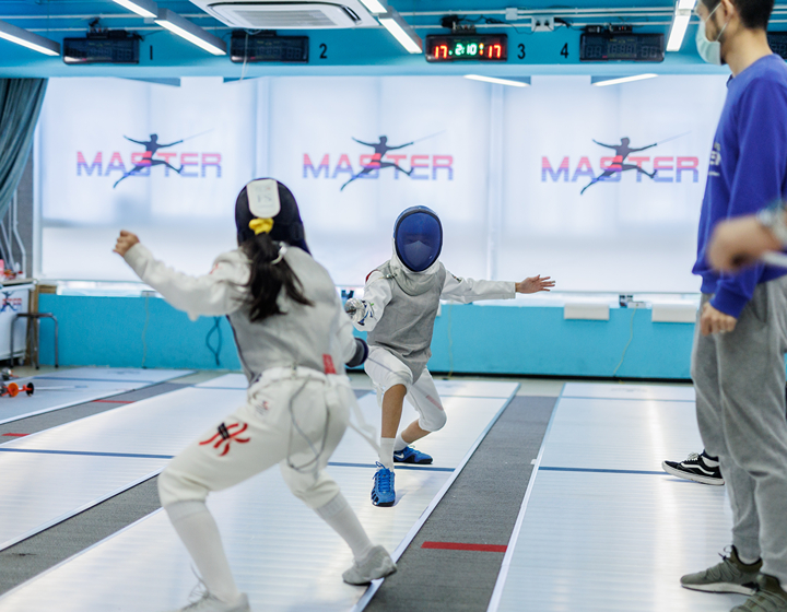 two students at an after-school fencing class at Hong Kong Fencing Master, extracurricular activity in sports fencing