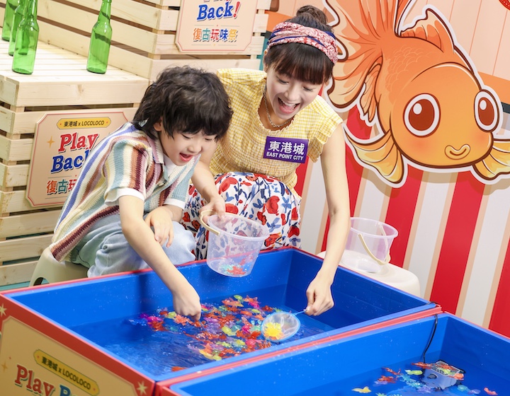mother and son play retro games at east point city in Hong Kong