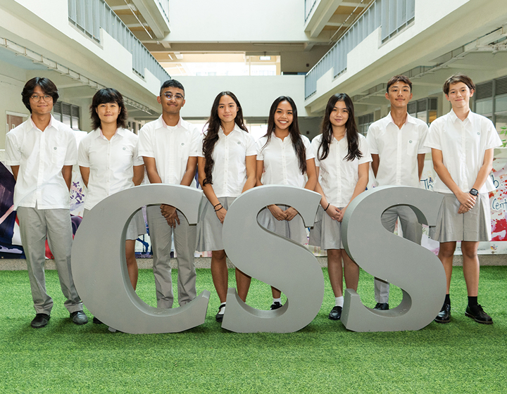IB Schools students standing behind CSS, Creative Secondary School students Hong Kong