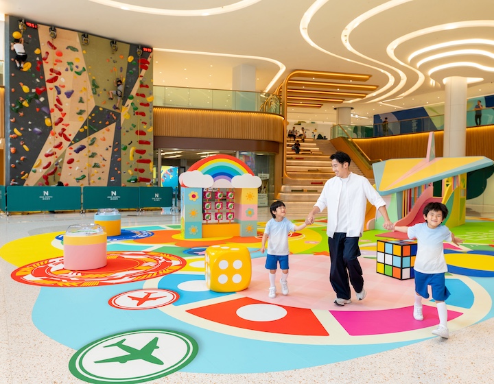 father and two children explore the fly high summer kids activity at Yuen Long Hong Kong