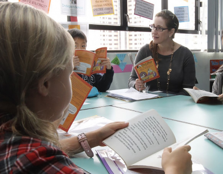 children reading at Hong Kong summer school classes by reading for meaning