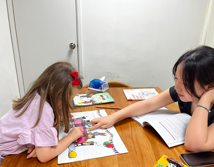 chinese teacher in a private mandarin class with a young student; Mandarin Channel School classes in Hong Kong